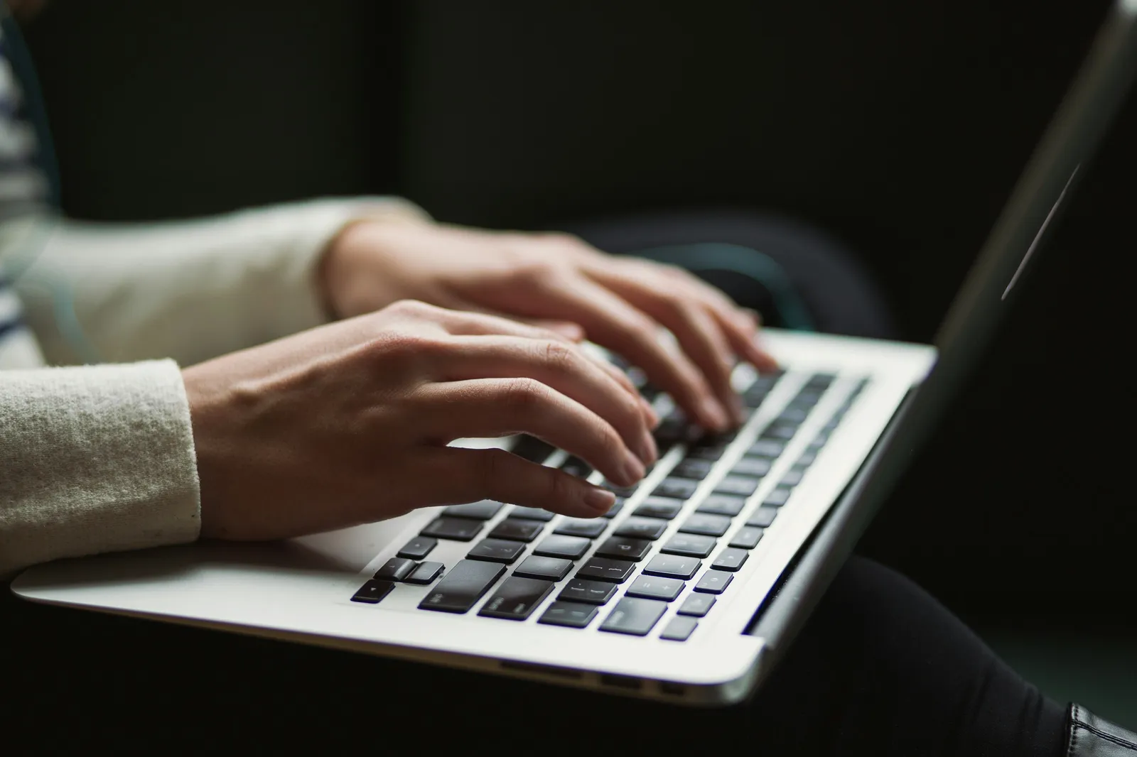Typing on laptop