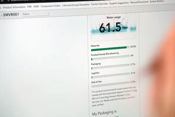 Computer screen displaying product environmental impact assessment with water usage and materials data.