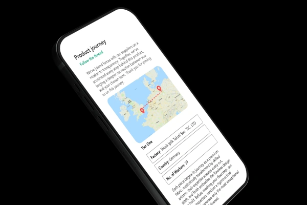 Smartphone displaying a product journey map and factory information for supply chain transparency.